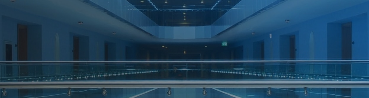 Interior of a hotel lobby, overlaid with a blue gradient